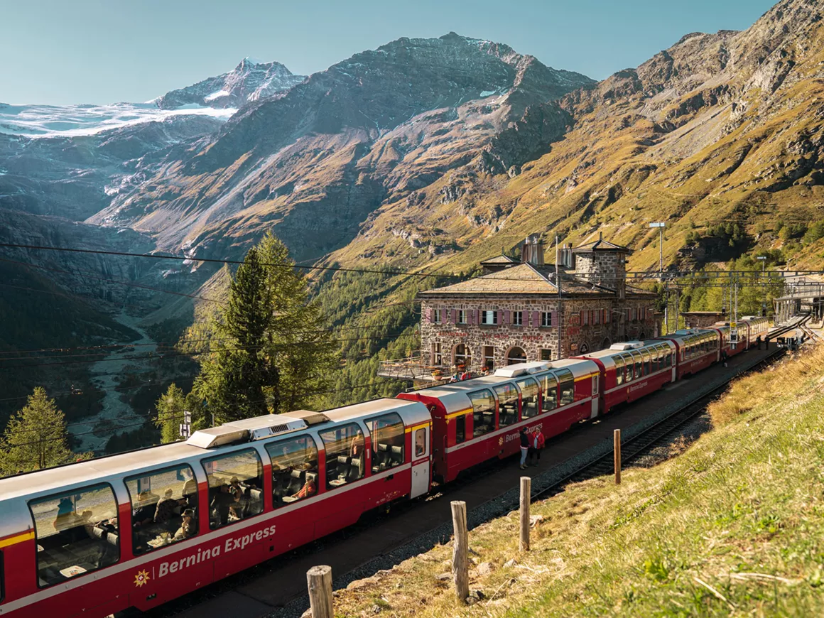 Bernina Express crossing the Brusio Spiral Viaduct in summer.